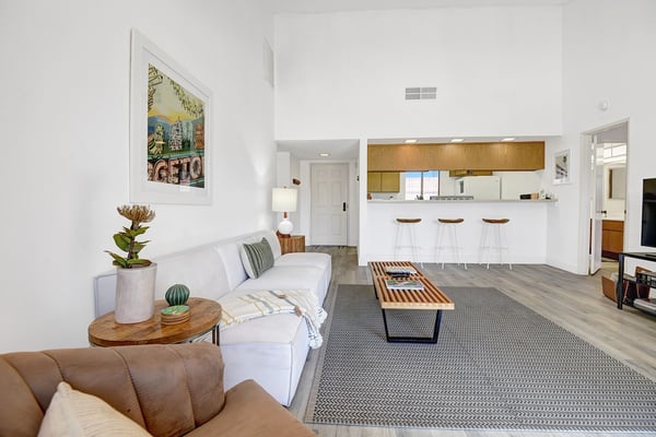 Stretch out on the sofa and feel the bright, airy space invite you to unwind. The open kitchen with bar seating makes mornings easy and evenings warm.