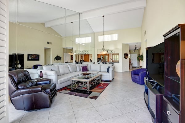Sink into plush sofas beneath soaring ceilings, where natural light pours in and elegant touches invite you to truly unwind and feel at home.