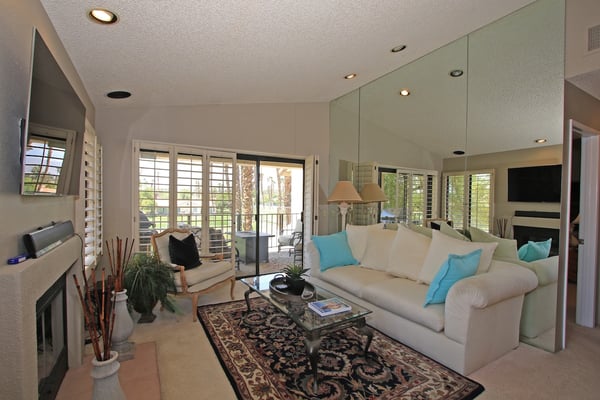 Relax into your spacious, light-filled living space where plush seating and calming touches create the perfect retreat after a day of desert adventures.