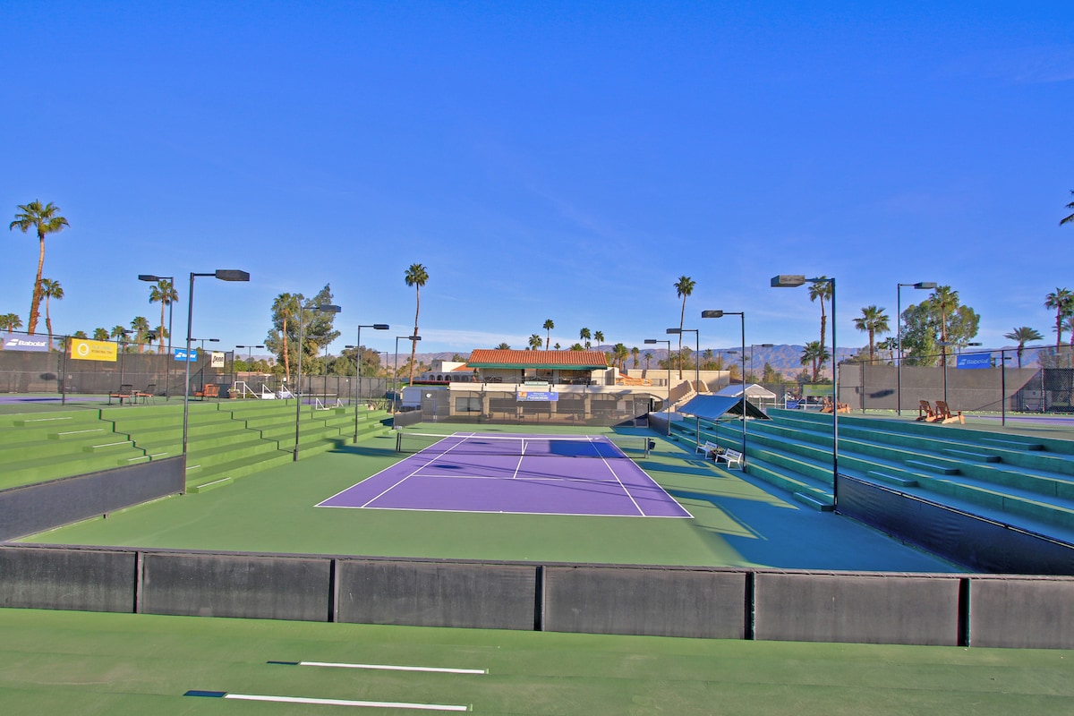 Championship-quality tennis courts await your competitive spirit, framed by swaying palms and stunning mountain views in this desert oasis.