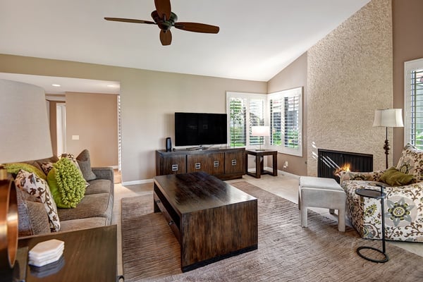 Settle into your spacious living area with vaulted ceilings, natural light, and a cozy fireplace. Stylish furnishings and an open floor plan create the perfect spot to unwind after exploring.