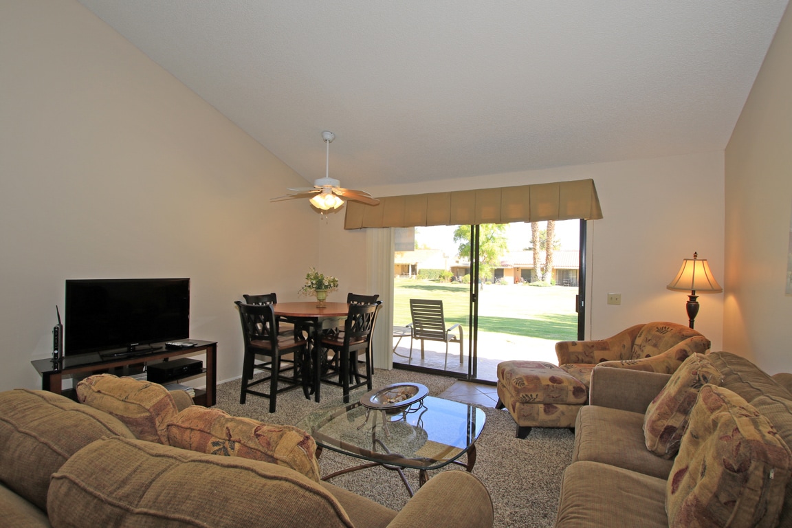 Settle into your bright, open living space with garden views through sliding doors. Plenty of seating invites you to unwind after exploring the desert.