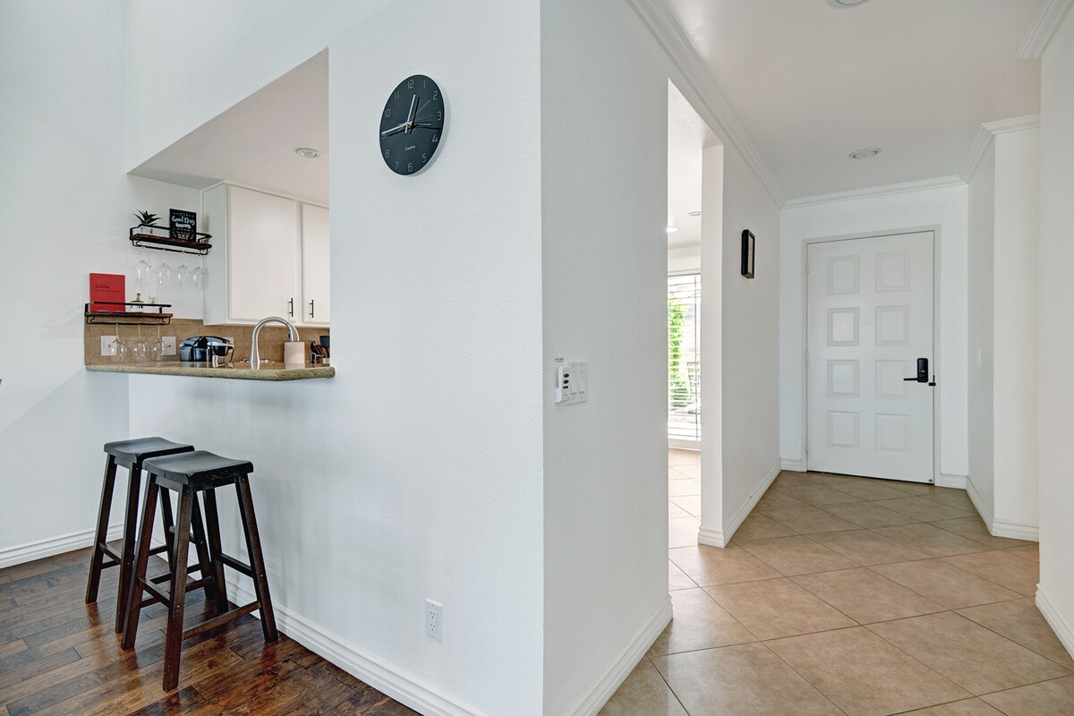 Step into your bright, welcoming retreat where a charming breakfast bar awaits your morning coffee and an open layout invites you to settle in and unwind.