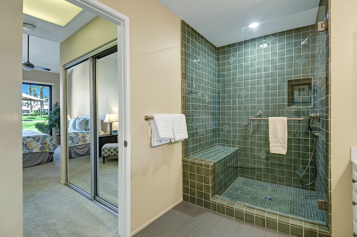 Step into your spa-like ensuite with its stunning green tiled walk-in shower—a refreshing retreat where you'll start each day feeling renewed and relaxed.