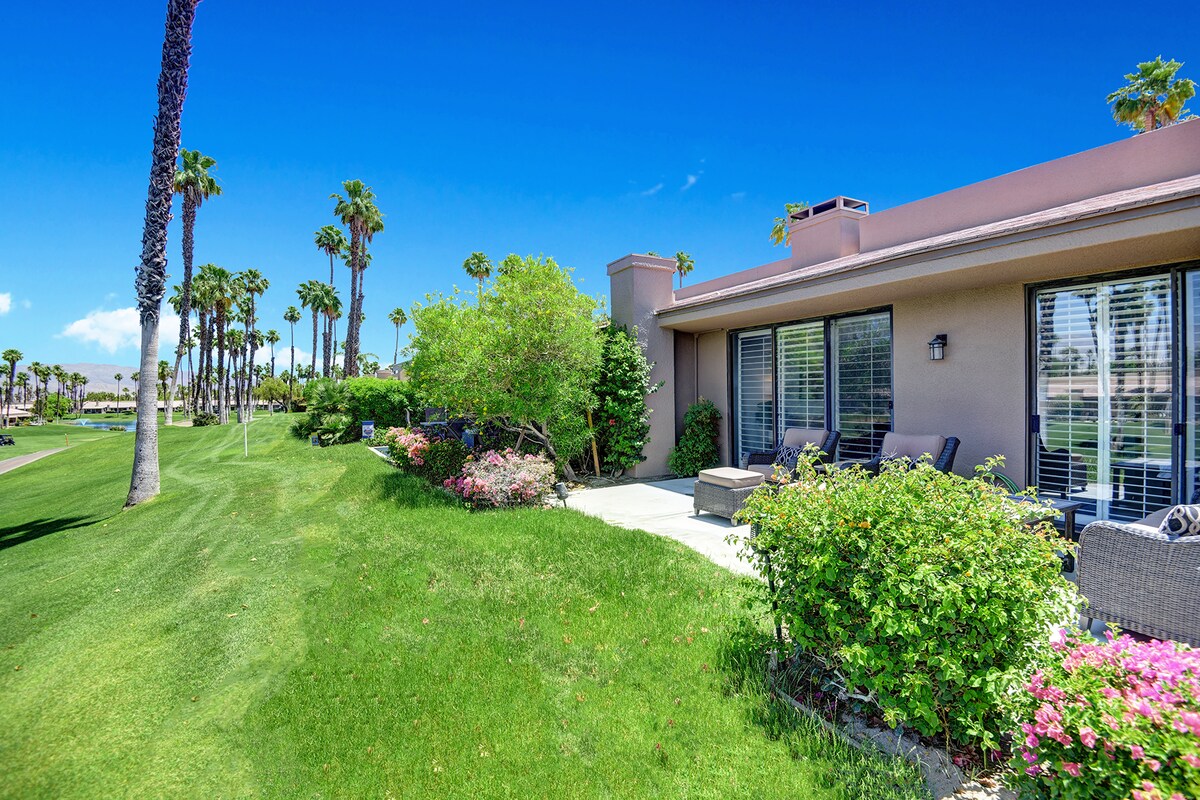 This resort-style property sits along a lush fairway lined with towering palms, offering vibrant landscaped gardens and a private patio perfect for sunny mornings with your coffee.