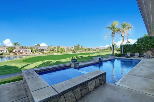 Imagine waking up to this: your private pool with integrated spa overlooking the lush fairways. Palm trees frame the view while the water sparkles under desert sun, inviting you to start each morning with a peaceful swim.
