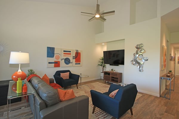 Settle into your stylish living space featuring soaring ceilings, modern décor, and comfortable seating perfect for unwinding after your adventures.