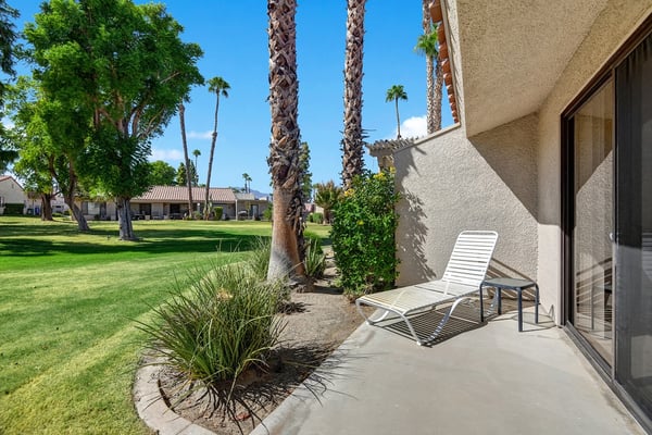 Step out onto your private patio and take in the lush green lawns and swaying palm trees that frame your relaxing oasis—perfect for morning coffee or soaking up the sun.