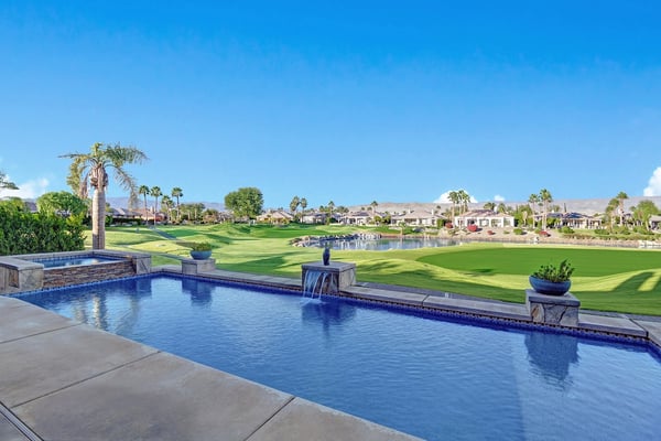 Stunning private pool overlooking pristine golf course fairways, framed by swaying palms and desert mountain views—your serene oasis for sunlit mornings and peaceful evenings.