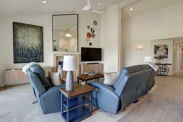 Sink into the plush blue recliners and unwind in this bright, open living space. Contemporary art and clean lines create a calming retreat, perfect for your downtime after a day of exploring.
