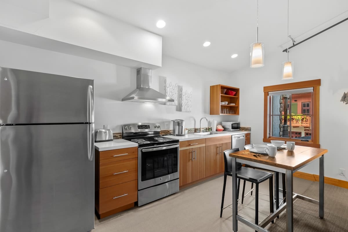 Kitchen with Stainless Appliances and Dining Area