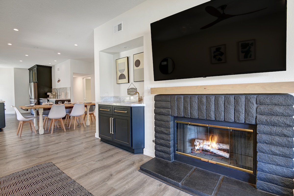 Warm up by your own cozy fireplace, then gather at the dining table for meals and laughter in this bright, open-concept space designed for togetherness.