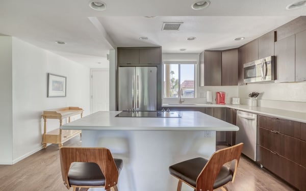 Your gourmet kitchen awaits with sleek modern finishes, spacious countertops, and stainless-steel appliances ready to inspire your culinary creations during your stay.