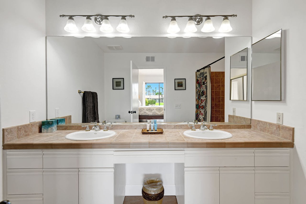 Refresh in your bright, generously sized bathroom with dual sinks, elegant fixtures, and plenty of counter space for all your essentials.