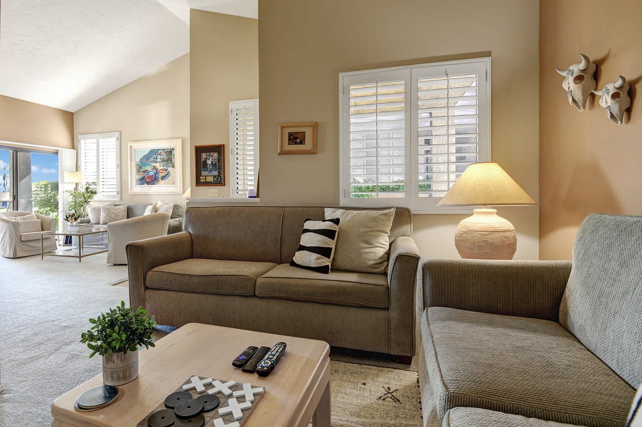 Sink into plush sofas bathed in natural light—your bright, airy living space invites you to unwind and feel at home the moment you arrive.