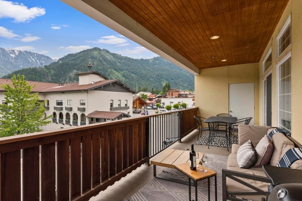 Soak in the stunning mountain views from your private terrace, where comfortable seating invites you to unwind with a glass of wine and watch the peaks glow at sunset.