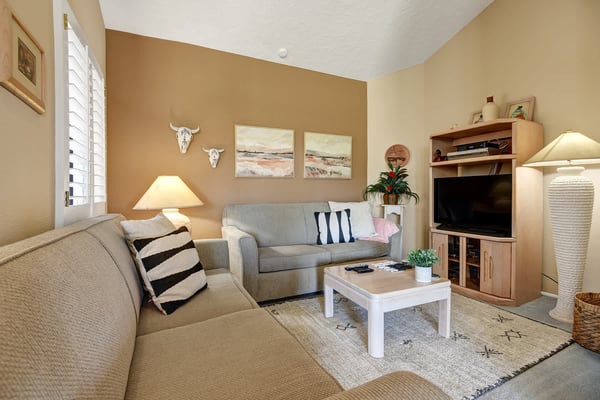 Settle into your comfortable living room, where warm desert tones, soft seating, and tasteful southwestern touches create the perfect space to unwind after exploring the area.