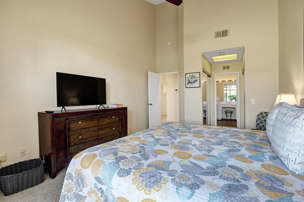 Settle into your bright, spacious bedroom where vaulted ceilings and soft natural tones create a peaceful retreat after a day of adventure.