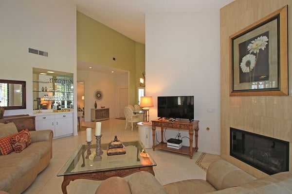 Settle into your comfortable living space, where warm lighting and thoughtful touches create the perfect atmosphere for relaxation after a day of desert adventure.