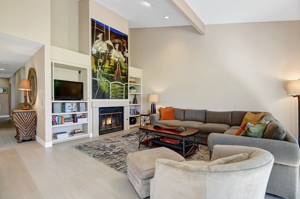 Relax in your spacious living room with vaulted ceilings, cozy fireplace, and plush seating designed for memorable conversations and quiet evenings in.