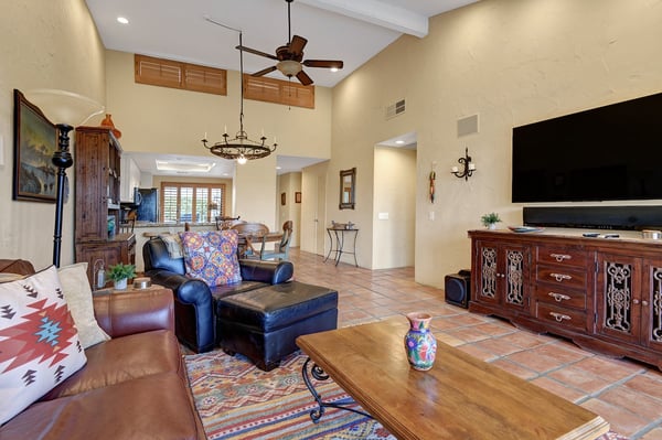 Unwind in your spacious living area with soaring ceilings, rich wood furnishings, and Southwestern charm—your perfect retreat after a day of adventure.