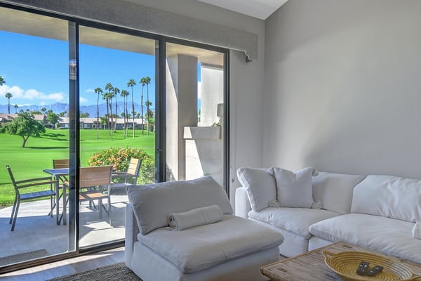 Sink into plush seating and let the spectacular mountain and golf course views refresh your spirit through expansive glass doors that open to your private patio.