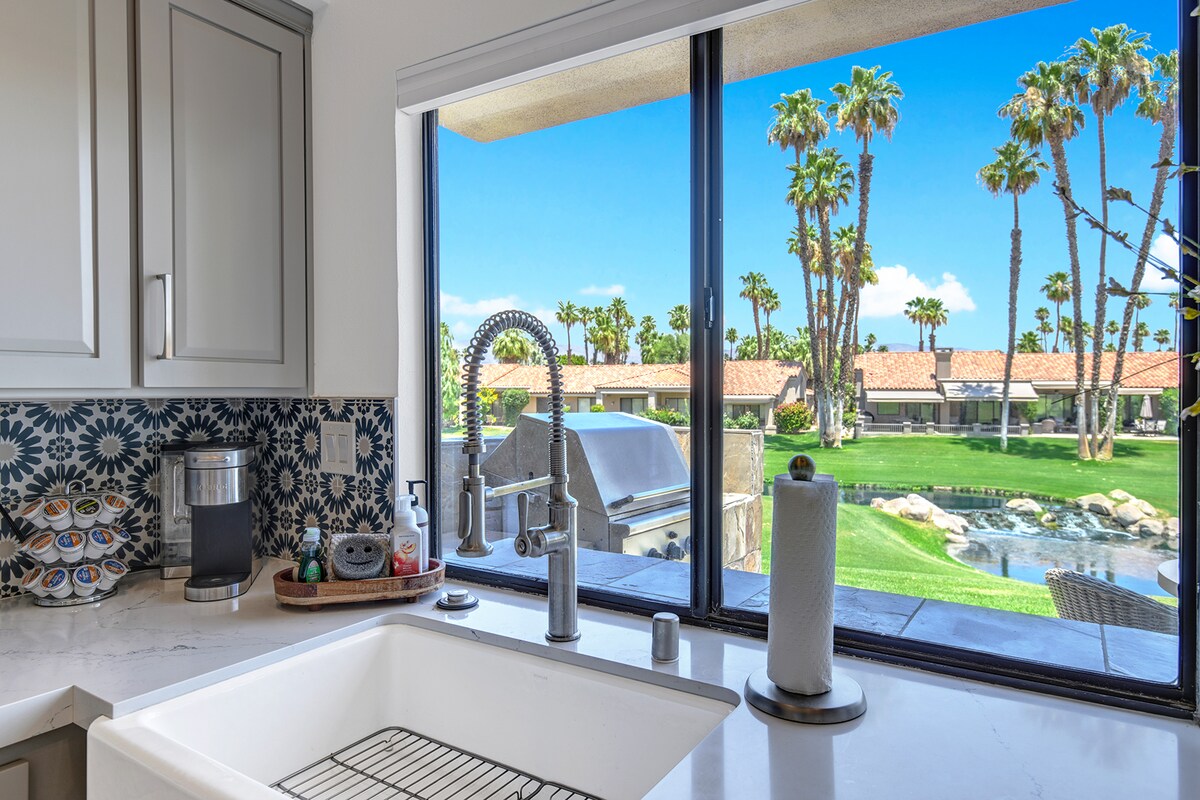 Watch swaying palm trees and lush greens from your kitchen window while prepping meals—a serene, sun-soaked backdrop that makes cooking feel like a vacation moment.