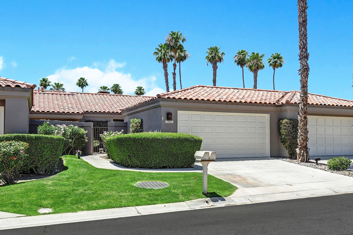 A sun-soaked desert retreat with vibrant landscaping, towering palms, and tile roofing that invites you to unwind in warm, California-style comfort.