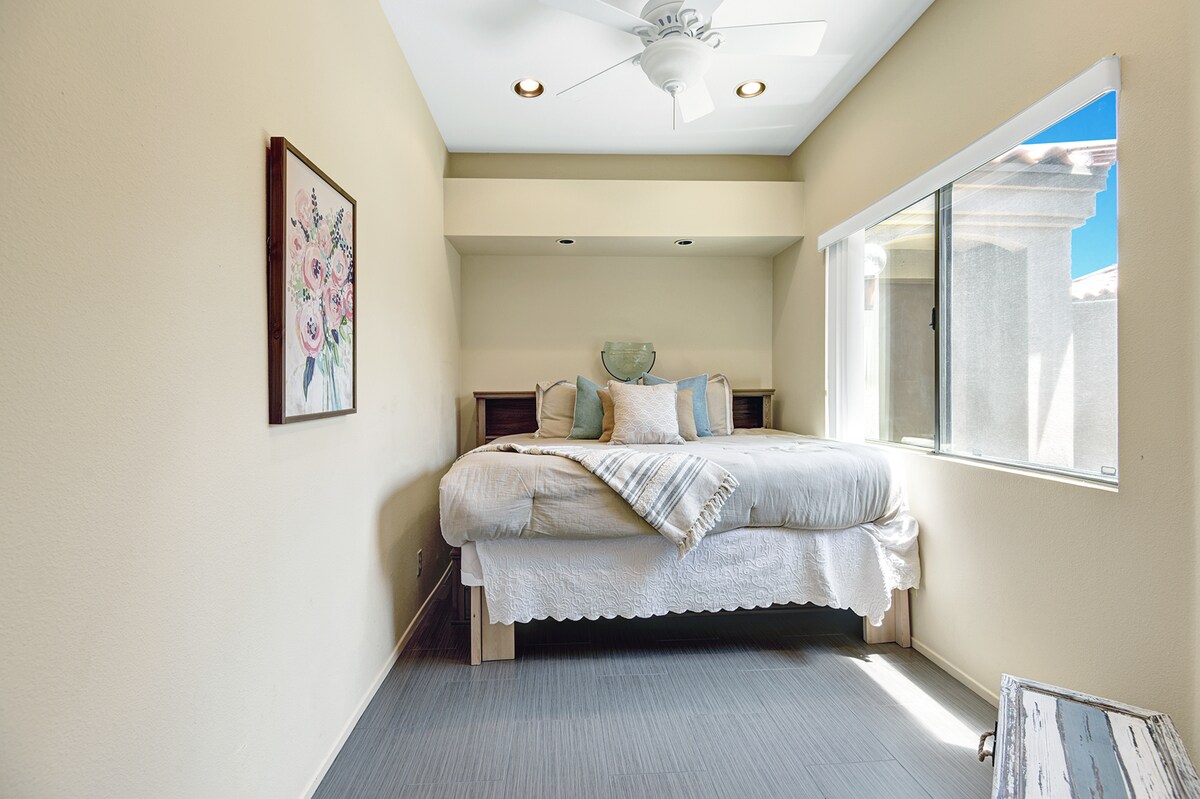 Sink into soft linens in your sunny, peaceful bedroom. The bright windows fill the space with natural light, creating a calm retreat for restful mornings and relaxing nights.