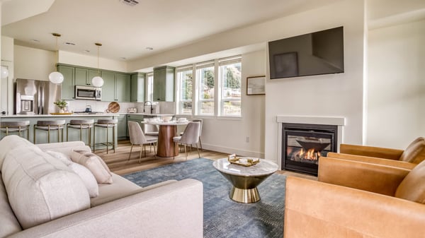 Sink into the plush seating and warm up by your private fireplace—this thoughtfully designed open-concept space blends modern comfort with inviting style, perfect for relaxing evenings in.