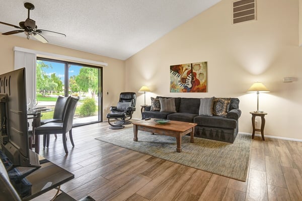 Bright, open living space with natural light, plush seating, and peaceful garden views. The perfect spot to unwind and relax.