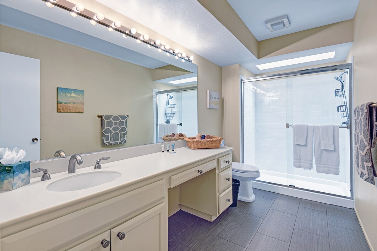 Refresh in your modern bathroom with dual vanities, bright lighting, and a spacious tub-shower combo—everything you need to unwind after a day of adventure.