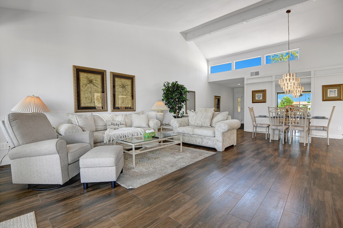 Step into your bright, airy living space where vaulted ceilings and sunlight create an effortlessly elegant atmosphere for relaxing and gathering with loved ones.