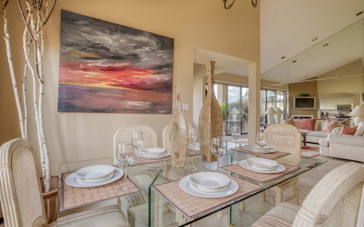 Step into your welcoming dining space, where elegant glass and natural textures blend seamlessly. Through the windows, glimpse the relaxing living area beyond, setting the scene for memorable meals together.