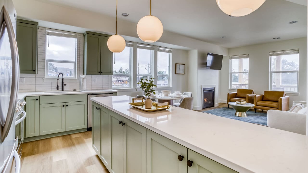 Settle into your open-concept retreat, where a bright kitchen flows effortlessly into a cozy living area—perfect for gathering, cooking, and relaxing after your adventures.