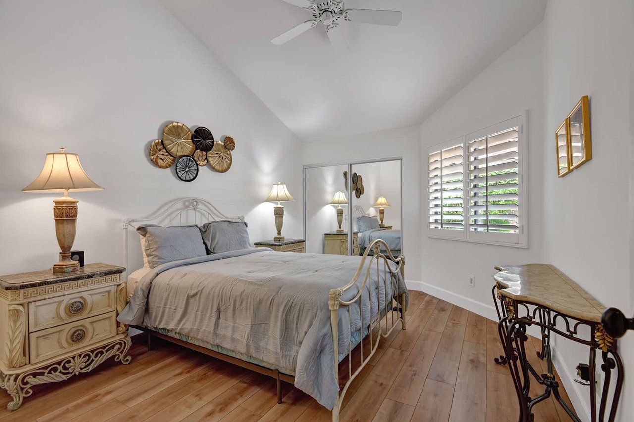 Your peaceful retreat awaits with vaulted ceilings, elegant coastal decor, and soft natural light filtering through plantation shutters—perfect for restful mornings and cozy evenings.