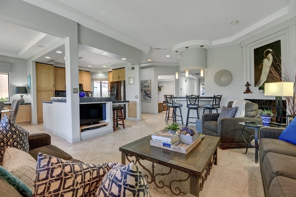 Open-concept living space where kitchen, dining, and living flow seamlessly. Stylish seating, pendant lights, and airy sightlines create the perfect setting to unwind and connect.