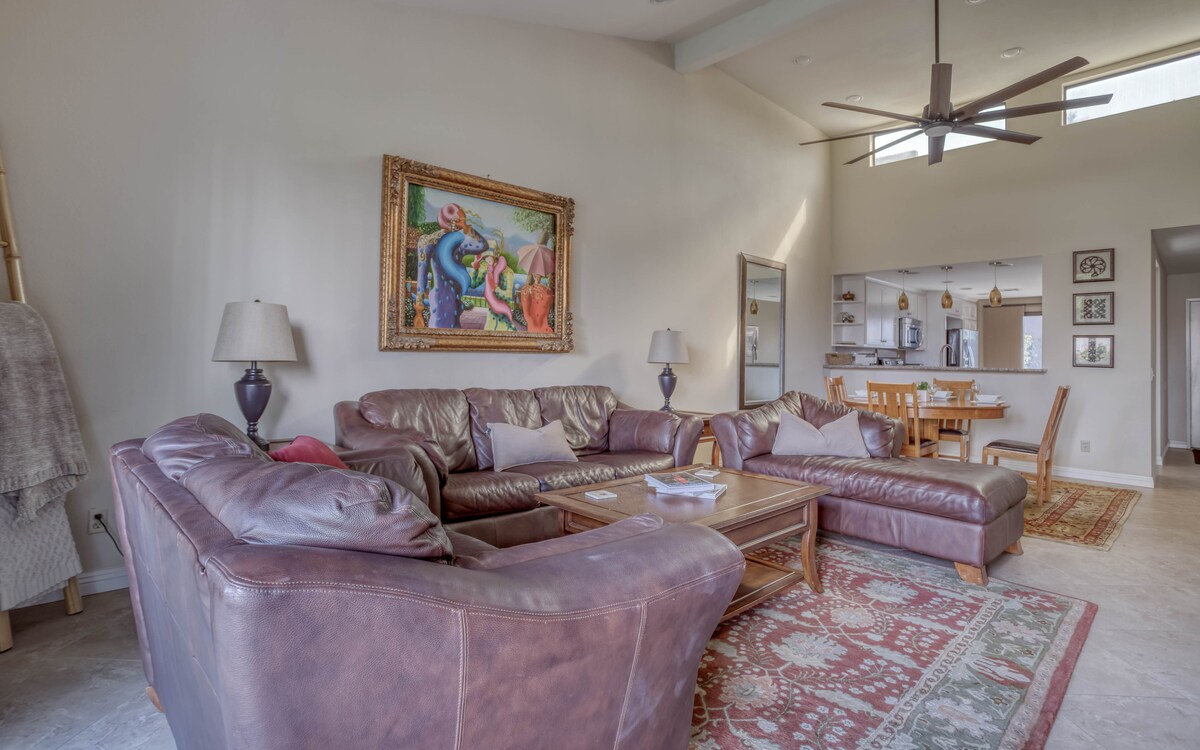 Sink into plush leather seating where you can gather with loved ones in this bright, open-concept space. Natural light flows in as your home away from home invites easy relaxation and shared moments.
