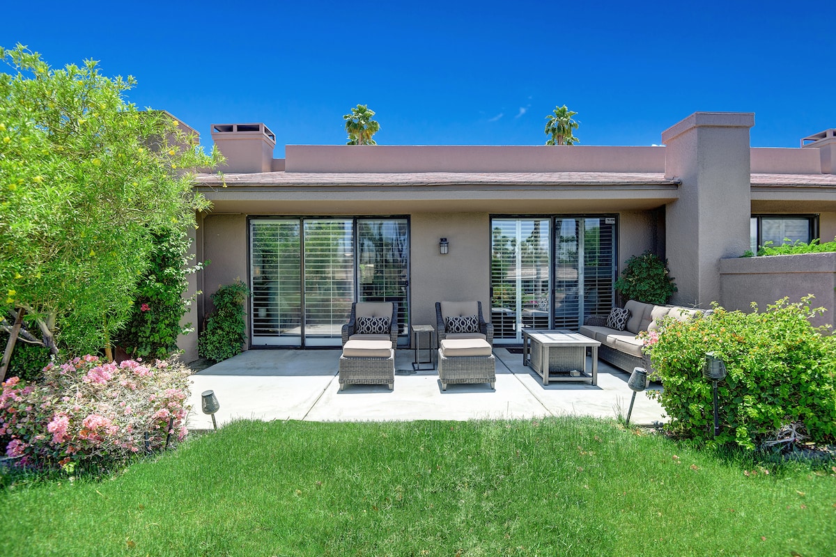 A modern desert retreat with your own private patio, framed by lush gardens and sunny skies—perfect for lounging with morning coffee or unwinding under the stars.