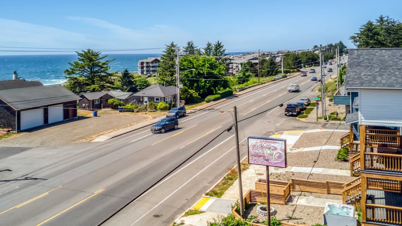 The property sits just steps from the coast, where charming neighborhoods meet the sparkling ocean along a scenic route perfect for exploring the area.
