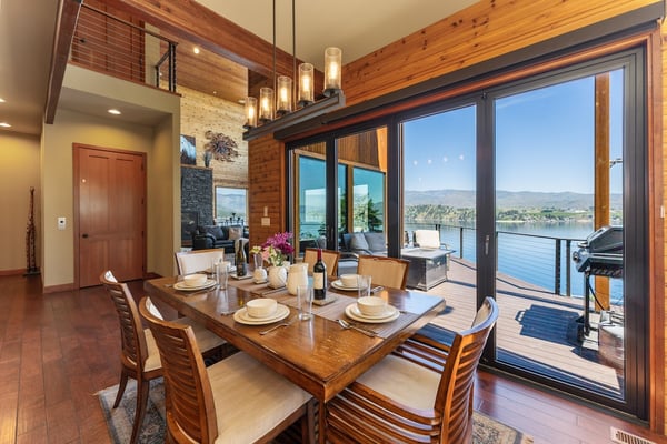 Dine with lakeside views through floor-to-ceiling windows. Warm wood accents and direct deck access make every meal feel like a special occasion.