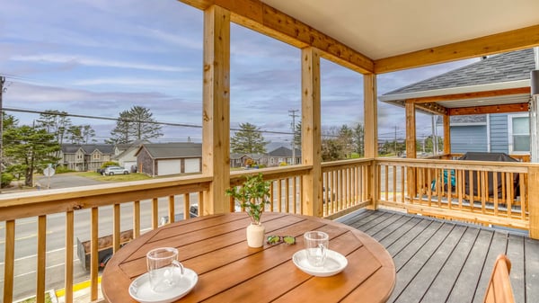 Sip your morning coffee on this covered deck, overlooking a peaceful residential neighborhood—a quiet spot to start your day.